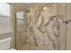 Elegant shower with marble tiling at 2205 Stonebridge Way, Clermont, FL 34711