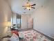 Bright bedroom featuring carpet flooring, vaulted ceiling, and ensuite bathroom at 24614 Stillridge Ct, Leesburg, FL 34748