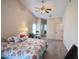 Bright bedroom featuring carpet flooring, vaulted ceiling, and ensuite bathroom at 24614 Stillridge Ct, Leesburg, FL 34748