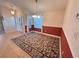 Dining room with tile flooring and decorative rug at 24614 Stillridge Ct, Leesburg, FL 34748