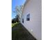 Exterior of house with neat lawn and blue sky at 24614 Stillridge Ct, Leesburg, FL 34748