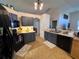 Well-lit kitchen with modern appliances and sleek cabinetry at 24614 Stillridge Ct, Leesburg, FL 34748