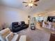 Spacious living room with comfortable seating and neutral color scheme at 24614 Stillridge Ct, Leesburg, FL 34748