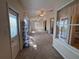 Bright sunroom featuring carpet flooring, multiple windows, ceiling fans, and sliding glass doors at 24614 Stillridge Ct, Leesburg, FL 34748