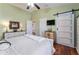 Bedroom with vaulted ceiling and barn door at 2602 Young Ln, The Villages, FL 32163