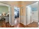 Hallway featuring entryways to the bedrooms and bathroom at 2602 Young Ln, The Villages, FL 32163