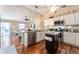 Modern kitchen featuring stainless steel appliances and ample cabinet space at 2602 Young Ln, The Villages, FL 32163