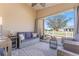 Relaxing screened-in lanai with comfortable seating and exterior views at 2602 Young Ln, The Villages, FL 32163