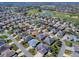 An aerial view showcasing the home's location within the golf course community at 2922 Rain Lily Loop, The Villages, FL 32163