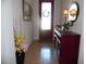 Inviting entryway featuring a console table, decorative mirror, and stylish accents at 31715 Parkdale Dr, Leesburg, FL 34748