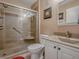 Modern bathroom features a glass-enclosed shower with seating and a vanity with a stone countertop at 337 Olanta Dr, The Villages, FL 32162