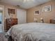 Cozy bedroom featuring neutral walls, a closet, and plush gray carpeting at 337 Olanta Dr, The Villages, FL 32162