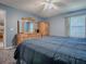 Comfortable bedroom showcasing natural light with a dresser and a closet at 337 Olanta Dr, The Villages, FL 32162