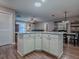 Spacious kitchen island with granite countertop offering additional storage and work space at 337 Olanta Dr, The Villages, FL 32162