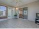 Enclosed back lanai with tile floors, ceiling fan and view to the backyard at 337 Olanta Dr, The Villages, FL 32162