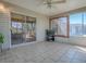 Relaxing sunroom with tile floors, ceiling fan and view to the outside at 337 Olanta Dr, The Villages, FL 32162