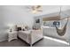 Bedroom featuring a ceiling fan, stylish furniture, natural light, and inviting atmosphere at 342 Lake Amberleigh Dr, Winter Garden, FL 34787