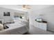 Bedroom showcasing neutral color scheme and decor, suspended hammock chair, and abundant natural light at 342 Lake Amberleigh Dr, Winter Garden, FL 34787