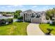 Beautiful two-story home with a well-manicured lawn and a spacious driveway leading to an attached two-car garage at 342 Lake Amberleigh Dr, Winter Garden, FL 34787