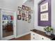 Hallway with hardwood floors, a white dresser, and a gallery wall of framed Gathering photos at 342 Lake Amberleigh Dr, Winter Garden, FL 34787