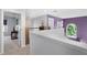 Bright loft featuring unique purple accent wall, abundant natural light and stylish decor throughout at 342 Lake Amberleigh Dr, Winter Garden, FL 34787