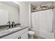 Bathroom featuring a tub and shower with marble tile, granite vanity, and white cabinets at 3646 Maidencain St, Clermont, FL 34714