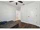 Bedroom with hardwood floors, a ceiling fan, and doorways leading to other rooms at 3646 Maidencain St, Clermont, FL 34714