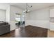 The dining area features dark wood flooring, and sliding glass doors that open to the exterior at 3646 Maidencain St, Clermont, FL 34714