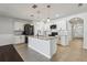 Spacious kitchen featuring a center island with granite countertops and stainless steel appliances at 3646 Maidencain St, Clermont, FL 34714