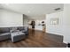 The living room opens to the kitchen offering hardwood flooring and a view into the kitchen space at 3646 Maidencain St, Clermont, FL 34714