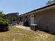 Exterior view of the home featuring access to the screened pool at 36709 Sandy Ln, Grand Island, FL 32735