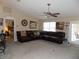 Spacious living room featuring a ceiling fan and ample natural light at 36709 Sandy Ln, Grand Island, FL 32735