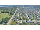 A beautiful aerial view of a residential neighborhood with neatly arranged houses and green spaces at 410 Majestic Gardens Blvd, Winter Haven, FL 33880