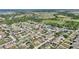 Aerial view of a residential neighborhood near fields and water, showcasing community layout at 410 Majestic Gardens Blvd, Winter Haven, FL 33880