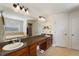 Bathroom with double vanity, granite countertop, soaking tub, and walk-in shower at 410 Majestic Gardens Blvd, Winter Haven, FL 33880