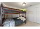 Cozy bedroom with bunk beds, ladder and stuffed animals providing a playful atmosphere at 410 Majestic Gardens Blvd, Winter Haven, FL 33880