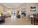 Open-concept living room featuring tile floors, a fireplace, and seamless access to the outdoor patio at 410 Majestic Gardens Blvd, Winter Haven, FL 33880