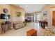 Open-concept living area featuring tile flooring and a view of the dining space at 410 Majestic Gardens Blvd, Winter Haven, FL 33880