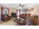 Spacious living room featuring a tray ceiling, comfortable seating, and lots of natural light at 410 Majestic Gardens Blvd, Winter Haven, FL 33880