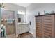 Bright bathroom featuring single vanity and a glass enclosed shower at 4419 Clear Brook Ct, Leesburg, FL 34748