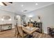 Cozy dining room features a classic table setting, warm lighting, and stylish decor at 4419 Clear Brook Ct, Leesburg, FL 34748