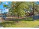 Community playground with several play structures and mature shade trees at 450 Liberty Ave # 3, Mount Dora, FL 32757