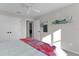 Bright bedroom featuring ceiling fan, carpet, and decorative features at 4521 Whittingtin Circle, The Villages, FL 32163