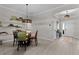 Dining room features statement lighting, seating for four and decorative floating shelves at 4521 Whittingtin Circle, The Villages, FL 32163