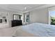 Bright main bedroom featuring closet and dresser with mirror, and carpet flooring at 4521 Whittingtin Circle, The Villages, FL 32163