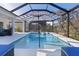 Stunning screened-in pool area with an umbrella and lots of room to relax and enjoy the backyard at 4521 Whittingtin Circle, The Villages, FL 32163