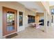 A view of the open-air back porch with a large table and a grill. Lots of sunlight and ventilation at 4571 Abaco Dr, Tavares, FL 32778