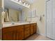 Bathroom featuring double sinks and a large mirror at 4571 Abaco Dr, Tavares, FL 32778