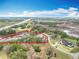 Overview of a large property with a modern farmhouse and lush surroundings, highlighted with a red perimeter line at 464 Long & Winding Rd, Groveland, FL 34736