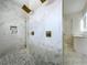 Marble look shower with gold fixtures at 464 Long & Winding Rd, Groveland, FL 34736